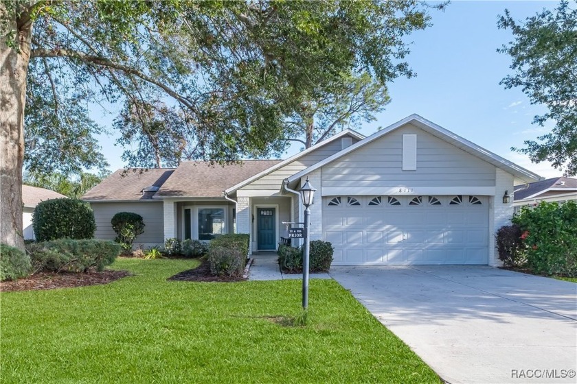 Nestled on a serene pond with no backyard neighbors, this - Beach Home for sale in Spring Hill, Florida on Beachhouse.com