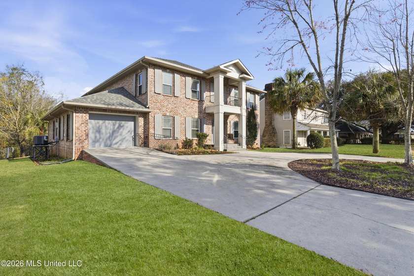 Welcome to this exceptional 4-bedroom, 5-bath custom waterfront - Beach Home for sale in Biloxi, Mississippi on Beachhouse.com