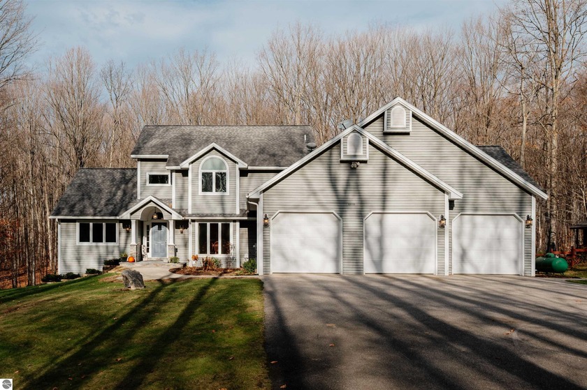 Welcome home to this beautiful, well-maintained 5-bedroom (plus - Beach Home for sale in Traverse City, Michigan on Beachhouse.com