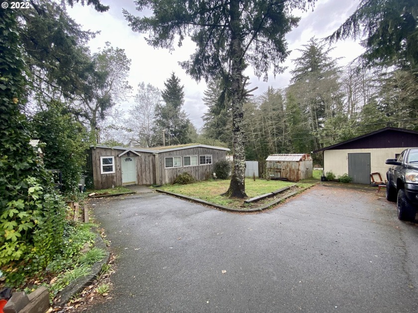 Tucked behind the trees off the highway, this 3 bedroom, 2 bath - Beach Home for sale in Warrenton, Oregon on Beachhouse.com
