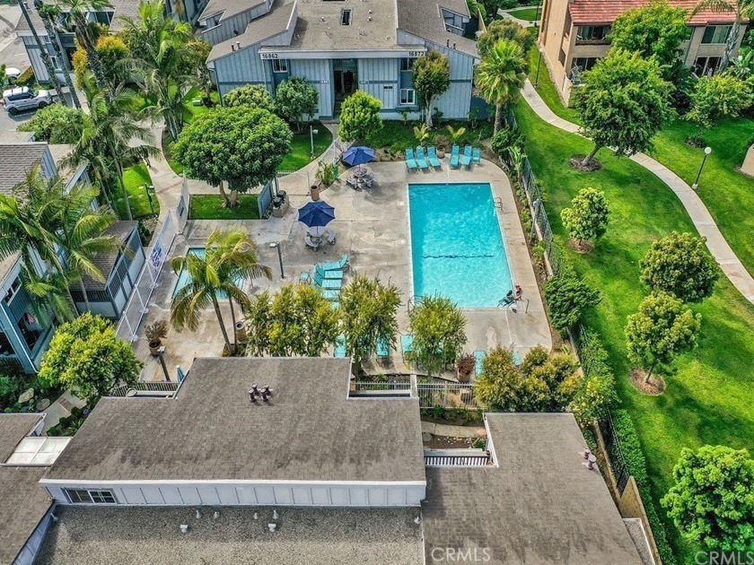 Located in Harbour Pacific, this ground floor end-unit beach - Beach Condo for sale in Huntington Beach, California on Beachhouse.com