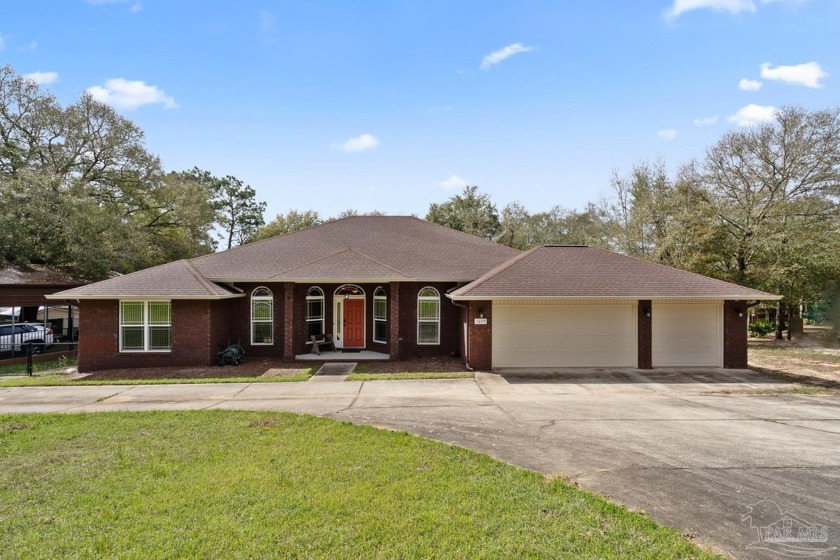 Welcome to this stunning 4-bedroom, 3-bathroom lakefront home on - Beach Home for sale in Milton, Florida on Beachhouse.com