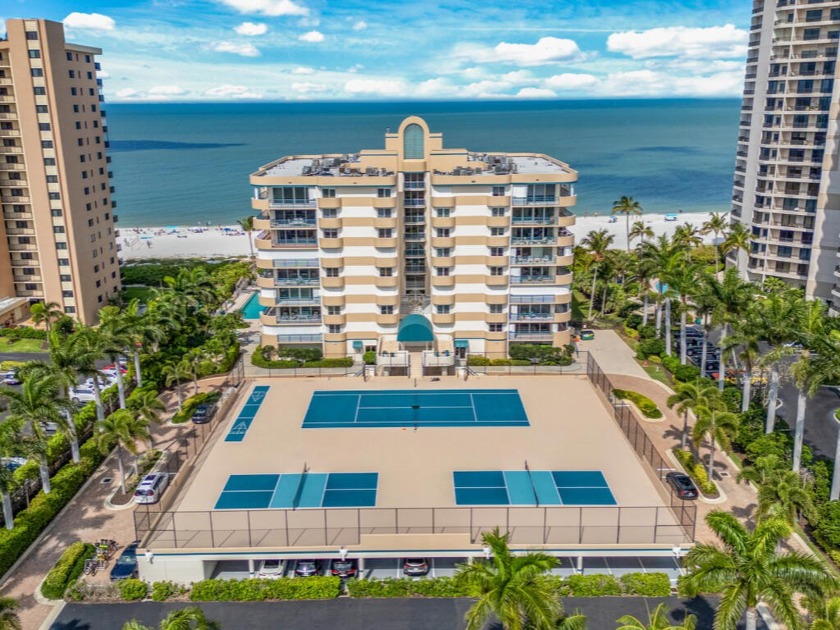 Nestled on the pristine shores of Marco Island, this beachfront - Beach Condo for sale in Marco Island, Florida on Beachhouse.com