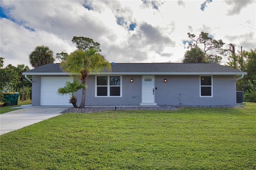LOOKING FOR A TOTALLY UPDATED HOME? Then this is the perfect - Beach Home for sale in Port Charlotte, Florida on Beachhouse.com