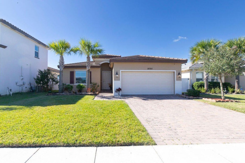 This charming, FULLY FENCED, CARPET-FREE home features laminate - Beach Home for sale in Port Saint Lucie, Florida on Beachhouse.com