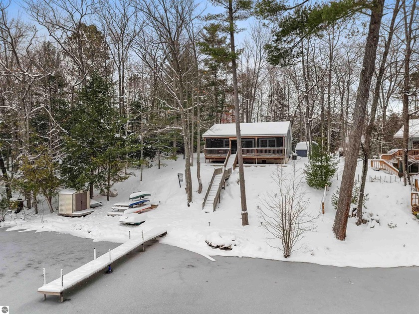 With 89 feet of private frontage on all-sports Spider Lake, this - Beach Home for sale in Traverse City, Michigan on Beachhouse.com