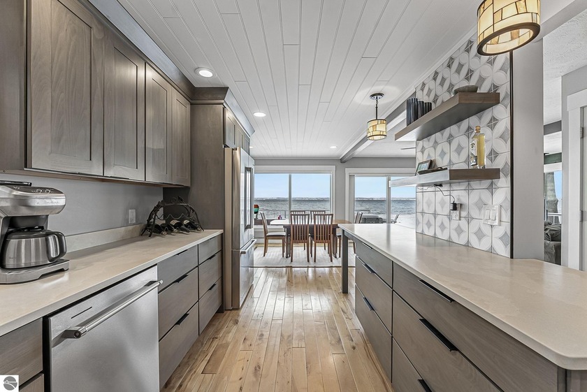 Experience waterfront living at its finest on coveted Mackenzie - Beach Home for sale in Kewadin, Michigan on Beachhouse.com