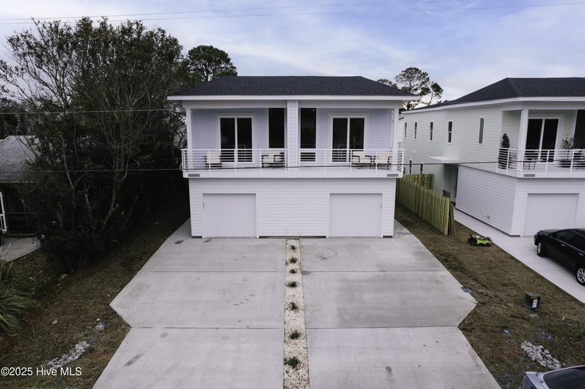 Experience modern coastal living in this stunning 3-bedroom, 2 - Beach Townhome/Townhouse for sale in Carolina Beach, North Carolina on Beachhouse.com