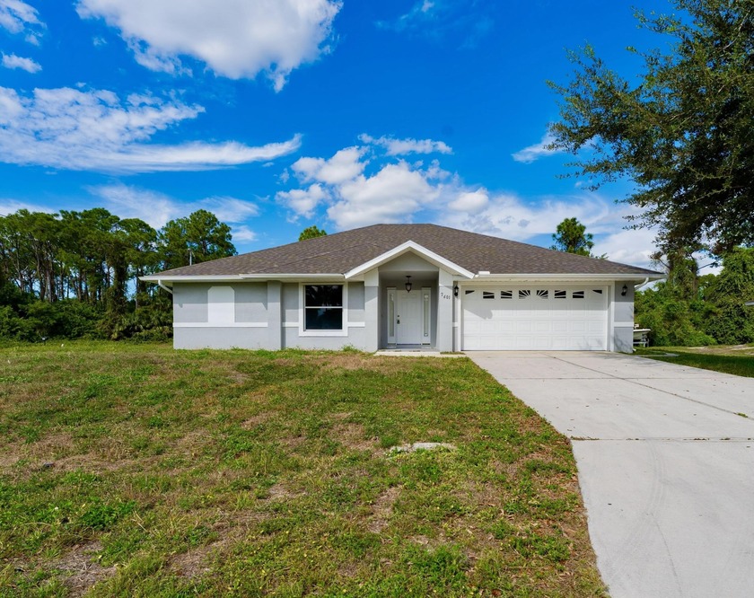 Sitting on a spacious half-acre corner lot, this updated home - Beach Home for sale in Lehigh Acres, Florida on Beachhouse.com