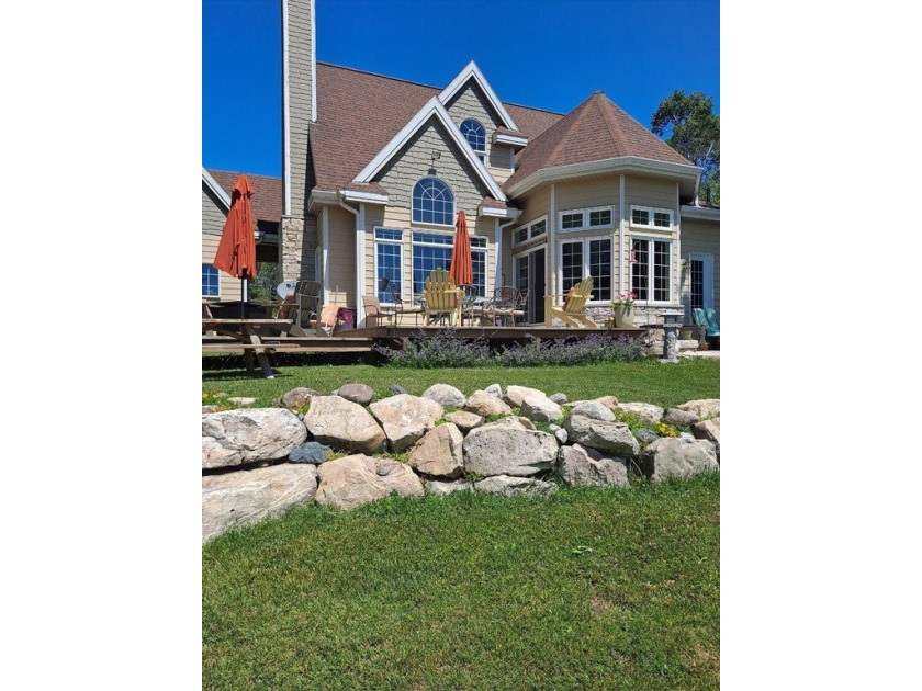 Discover the epitome of waterfront living in this stunning 2,000 - Beach Home for sale in Cedarville, Michigan on Beachhouse.com