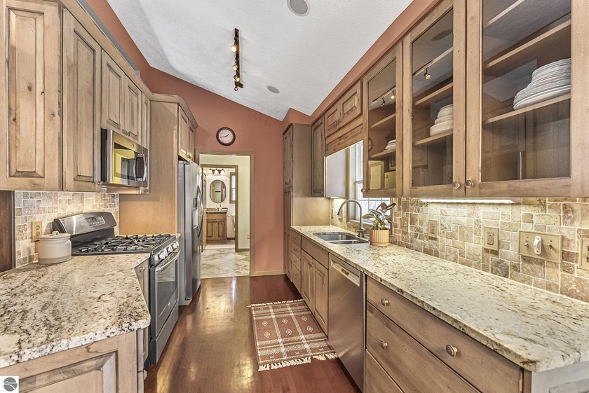 Tucked into a quiet, established West Side neighborhood, this - Beach Home for sale in Traverse City, Michigan on Beachhouse.com