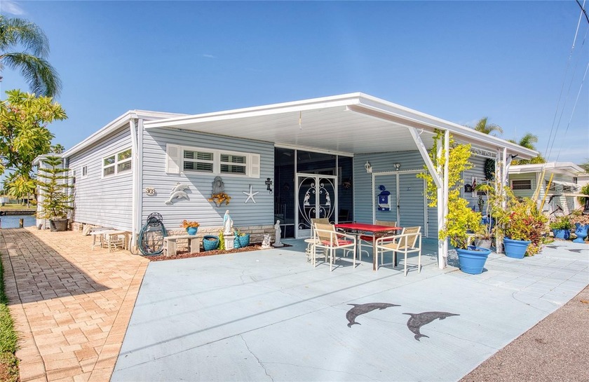 ESCAPE TO FLORIDA! THIS UNIQUE TRIPLE WIDE THREE BEDROOM TWO - Beach Home for sale in Clearwater, Florida on Beachhouse.com