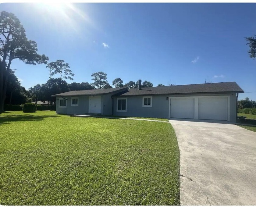 Stunning ranch-style home nestled on a prime 1.77-acre lot! This - Beach Home for sale in West Palm Beach, Florida on Beachhouse.com