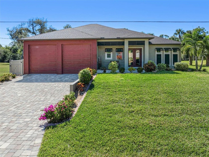 STUNNING Canal-Front Estate with heated POOL, DOUBLE LOT & - Beach Home for sale in North Port, Florida on Beachhouse.com