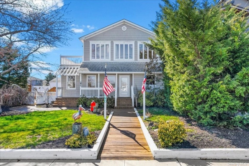 A warm welcome awaits as you step into this home with its unique - Beach Home for sale in Lindenhurst, New York on Beachhouse.com
