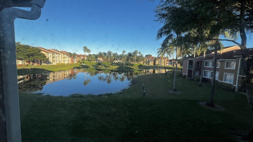 Lovely lake view from patio, living room and bedroom.  Vaulted - Beach Condo for sale in Lake Worth, Florida on Beachhouse.com