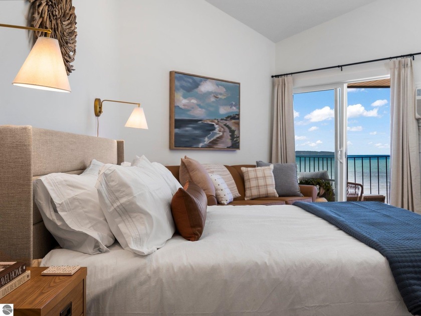 Nestled along the sought-after *Miracle Mile* of East Bay, this - Beach Condo for sale in Traverse City, Michigan on Beachhouse.com