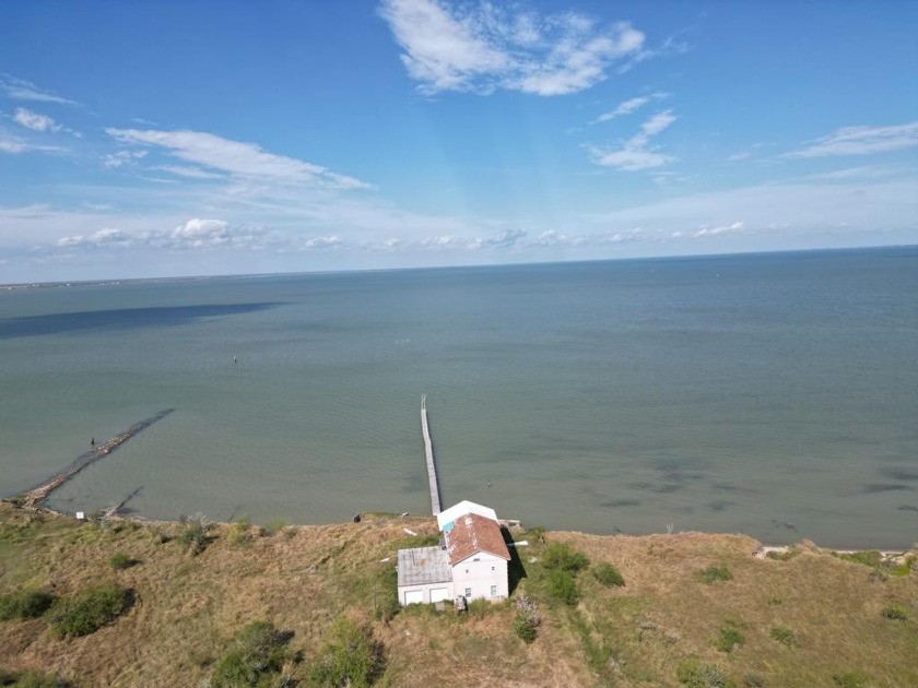 Bayfront Acreage with a pier! 4/3.5/2 Concrete with Stucco - Beach Home for sale in Taft, Texas on Beachhouse.com