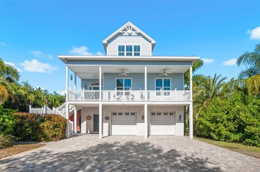Discover this exceptional 4-bedroom, 3.5-bath luxury estate with - Beach Home for sale in Tarpon Springs, Florida on Beachhouse.com