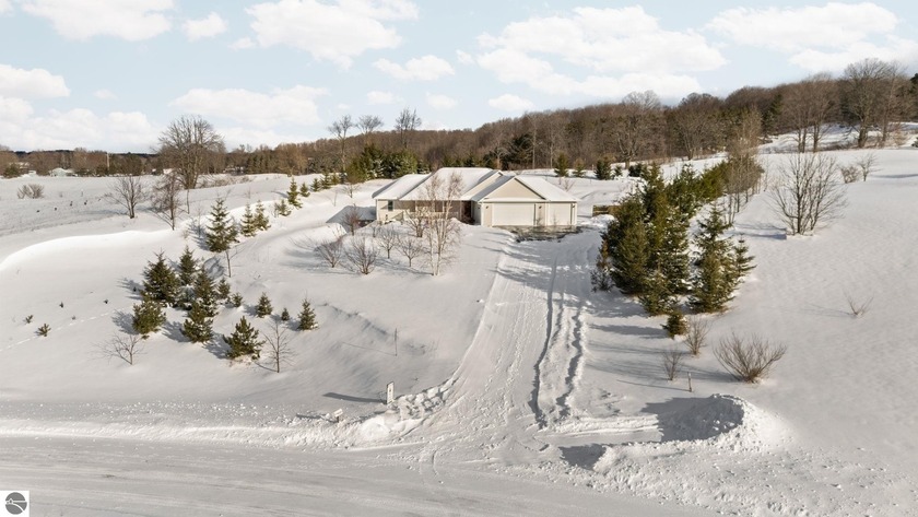 Privately positioned on 1.2 acres with direct access to a 20 - Beach Home for sale in Traverse City, Michigan on Beachhouse.com