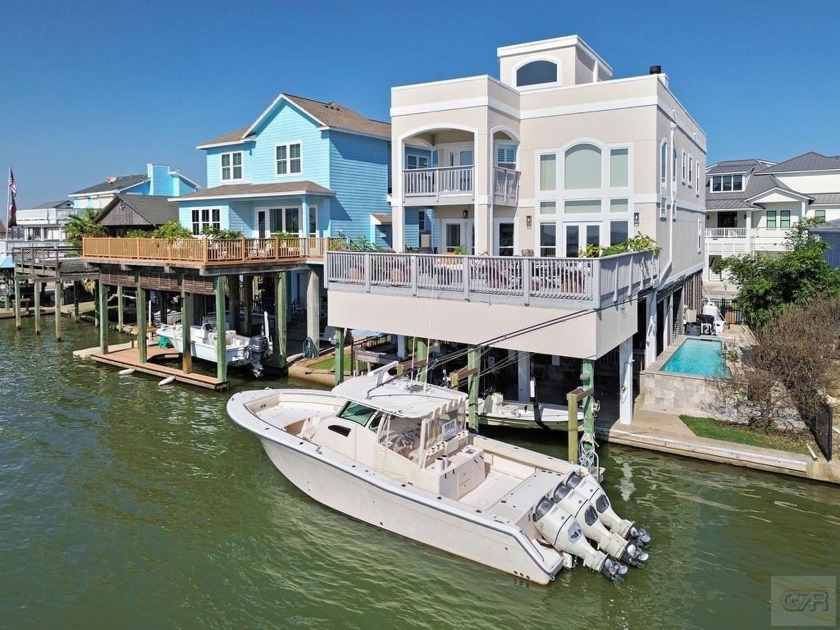 Gorgeous 4 bedroom 4 bath Tiki home with awesome West Bay Views - Beach Home for sale in Tiki Island, Texas on Beachhouse.com