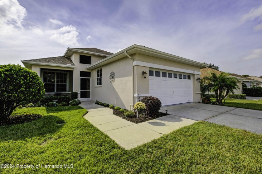 GOLF COURSE FRONTAGE! Sitting between the 3rd green and 4th - Beach Home for sale in Spring Hill, Florida on Beachhouse.com