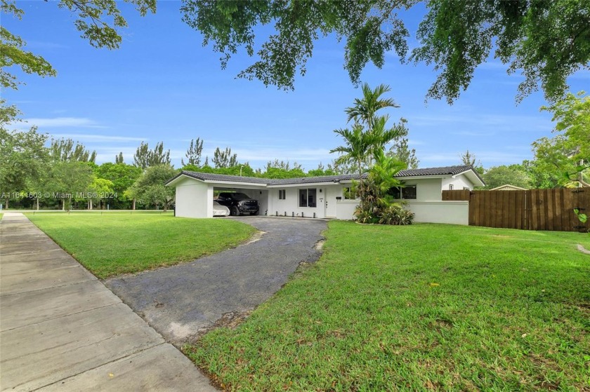 Imagine living in a single-story home, with no HOA, situated on - Beach Home for sale in Miami Springs, Florida on Beachhouse.com