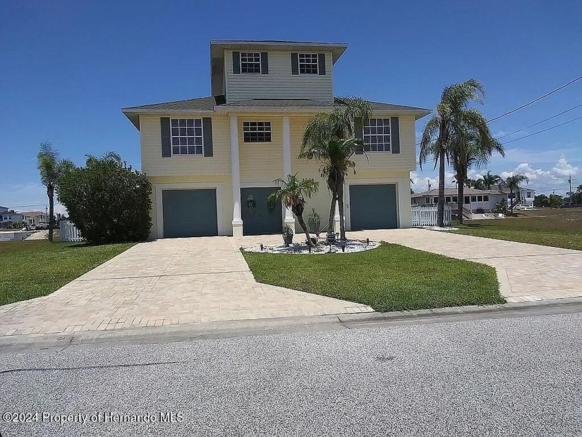 Discover coastal living at its finest in this beautiful Hernando - Beach Home for sale in Hernando Beach, Florida on Beachhouse.com