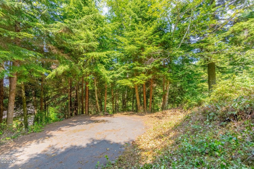 This private  .30 acre lot in Salishan Hills has a paved - Beach Lot for sale in Gleneden Beach, Oregon on Beachhouse.com