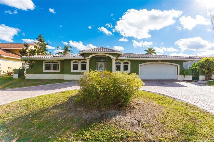 This waterfront pool home with 2 car garage is ready for updates - Beach Home for sale in Pompano Beach, Florida on Beachhouse.com