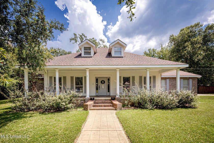 Step into timeless Southern charm with this beautiful - Beach Home for sale in Ocean Springs, Mississippi on Beachhouse.com