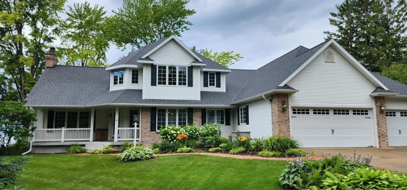 Sitting on 2.1 acres with 233' of shore-protected water frontage - Beach Home for sale in Brussels, Wisconsin on Beachhouse.com