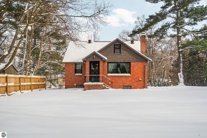 Set near the base of Old Mission Peninsula, this well-located 3 - Beach Home for sale in Traverse City, Michigan on Beachhouse.com