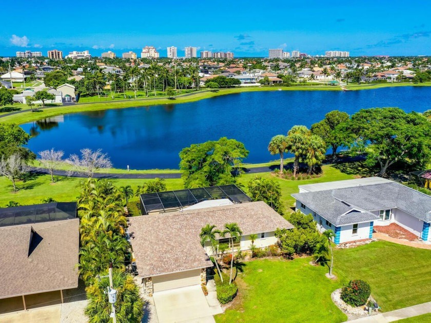 Paradise awaits you at this charming, lakefront home on - Beach Home for sale in Marco Island, Florida on Beachhouse.com