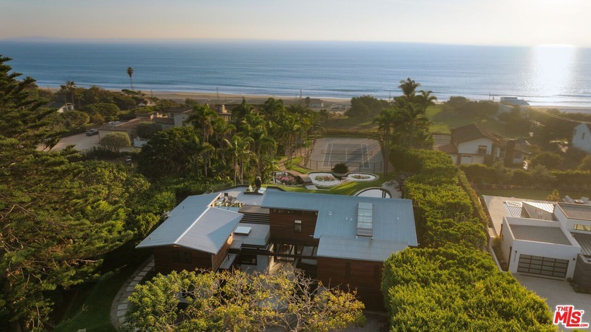 Set amid mature trees and manicured grounds with ocean and - Beach Home for sale in Malibu, California on Beachhouse.com