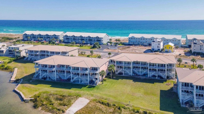 Located directly on Little Sabine Bay, this two bedroom, two and - Beach Home for sale in Pensacola Beach, Florida on Beachhouse.com