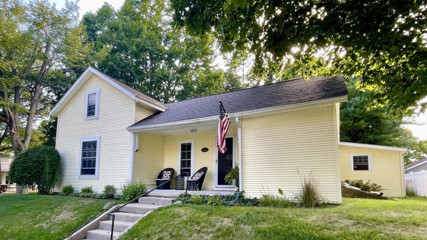 Nestled in the picturesque Village of Pentwater, this charming - Beach Home for sale in Pentwater, Michigan on Beachhouse.com