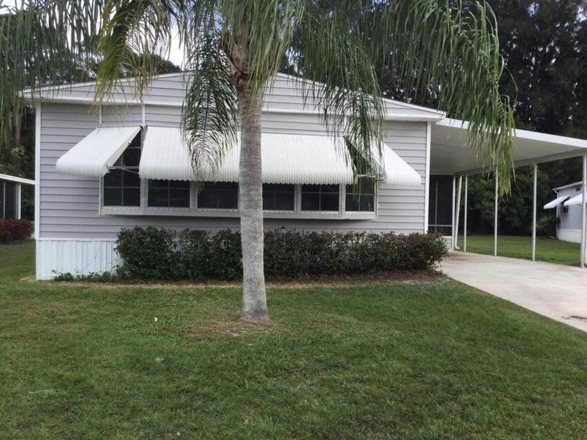 Lovely remodeled home with new kitchen, flooring, roof and - Beach Home for sale in Port Saint Lucie, Florida on Beachhouse.com