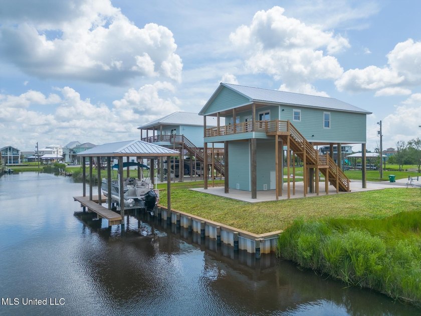 Custom waterfront living meets the relaxed coastal lifestyle at - Beach Home for sale in Bay Saint Louis, Mississippi on Beachhouse.com