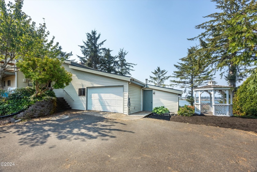 Almost every room of this exceptional 2-bedroom, 2-bathroom home - Beach Home for sale in South Beach, Oregon on Beachhouse.com