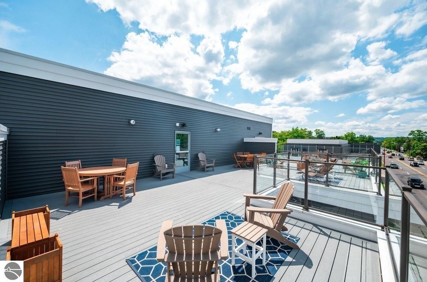 Turn-key, main floor, end-unit condo with a rooftop deck near - Beach Condo for sale in Traverse City, Michigan on Beachhouse.com