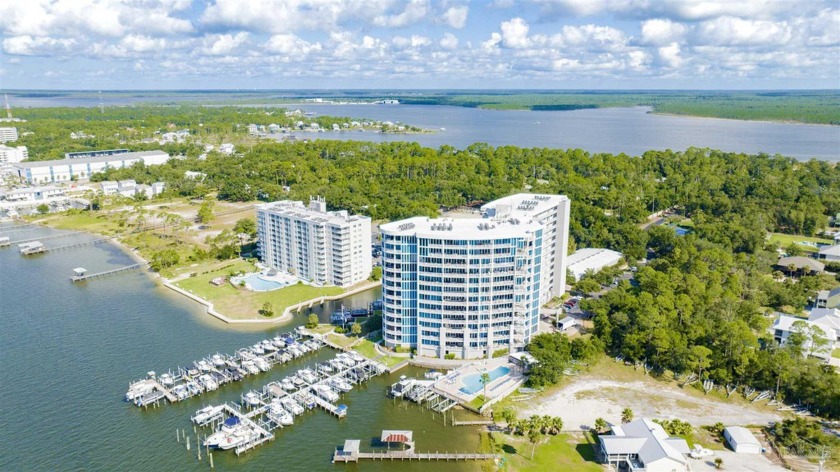 Stunning water views! Exclusive waterfront living located on - Beach Home for sale in Orange Beach, Alabama on Beachhouse.com