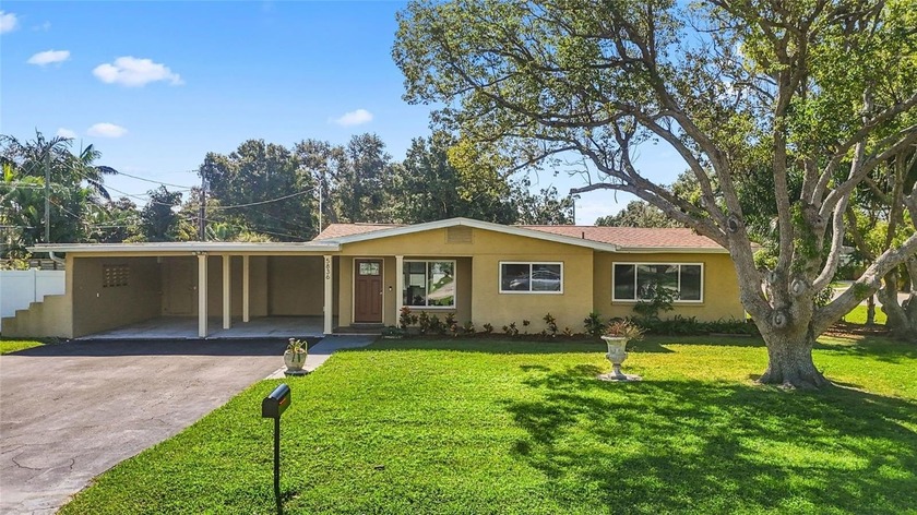 Set on a .27-acre corner lot in Flood Zone X, this - Beach Home for sale in Gulfport, Florida on Beachhouse.com