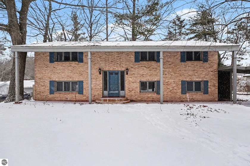 Spacious, all-brick, bi-level home in an established - Beach Home for sale in Oscoda, Michigan on Beachhouse.com