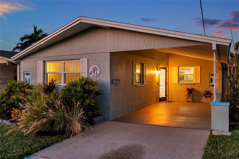 UNOBSTRUCTED GULF ACCESS. PRIVATE BEACH. CUTE AS A BUTTON - Beach Home for sale in New Port Richey, Florida on Beachhouse.com