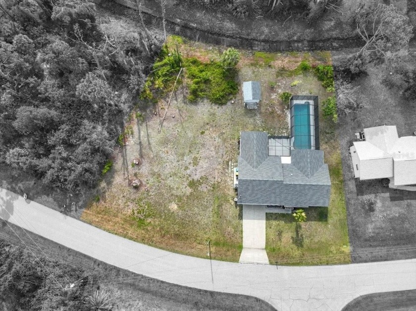 This custom-built three-bedroom, two-bath pool home is situated - Beach Home for sale in Englewood, Florida on Beachhouse.com