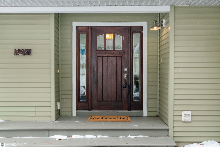 Set on the peaceful shores of no-wake Tibbets Lake, just minutes - Beach Home for sale in Traverse City, Michigan on Beachhouse.com