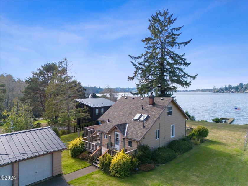 A charming lakefront cabin with approximately 90 feet of - Beach Home for sale in Otis, Oregon on Beachhouse.com