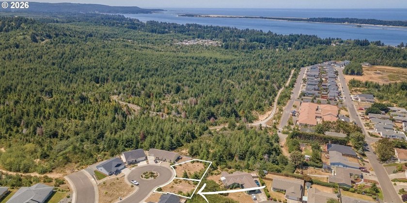 Discover this mostly level, buildable lot in the sought-after - Beach Lot for sale in Coos Bay, Oregon on Beachhouse.com