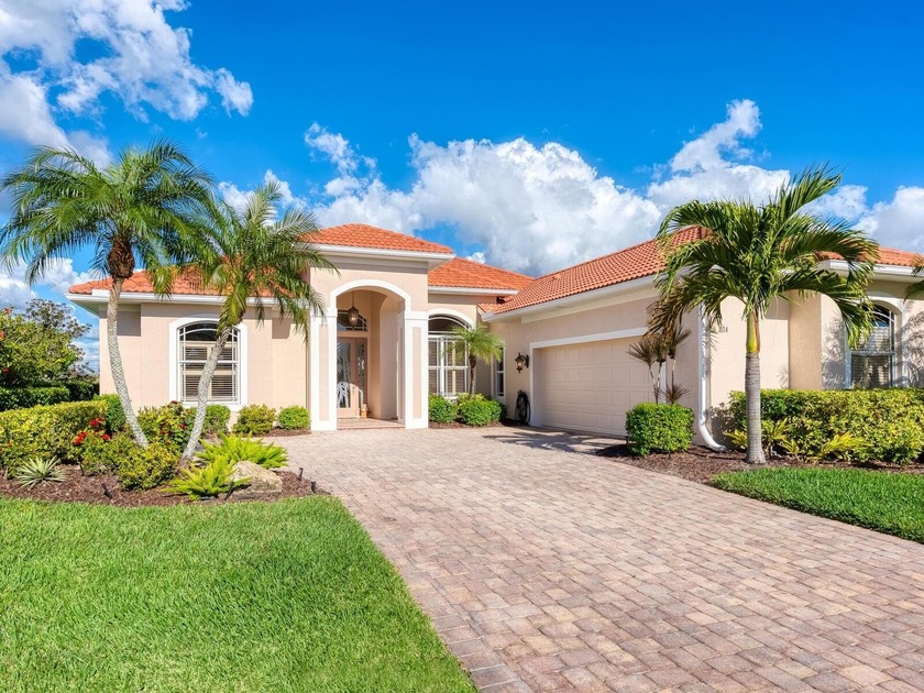 Enjoy sparkling lake and golf course views from this exceptional - Beach Home for sale in Venice, Florida on Beachhouse.com